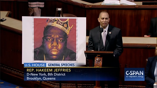 Leader Jeffries speaks on the floor with a picture of the notorious B.I.G.